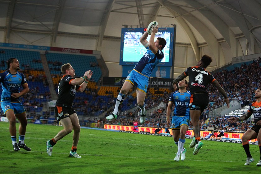 Gold Coast Titans winger Anthony Don leaps high.