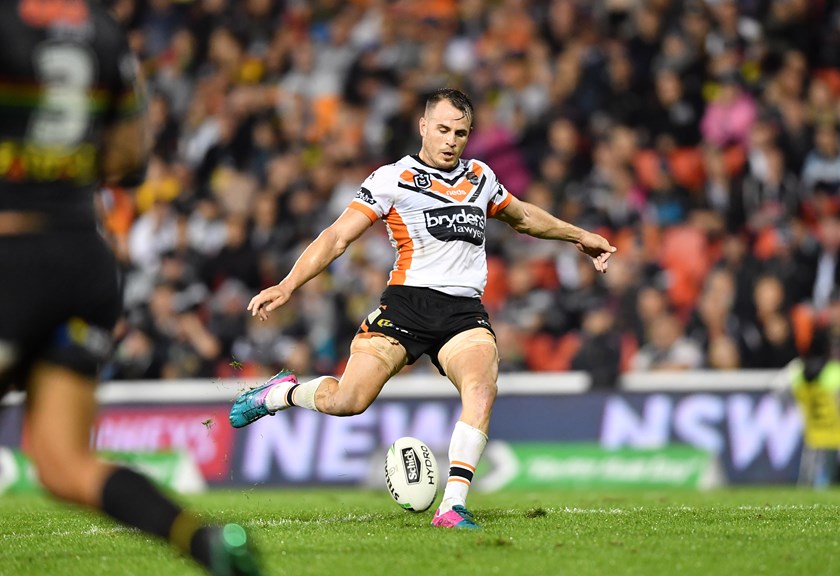 Tigers five-eighth Josh Reynolds takes aim for the field goal that hit the upright in the 9-8 loss to Penrith. 