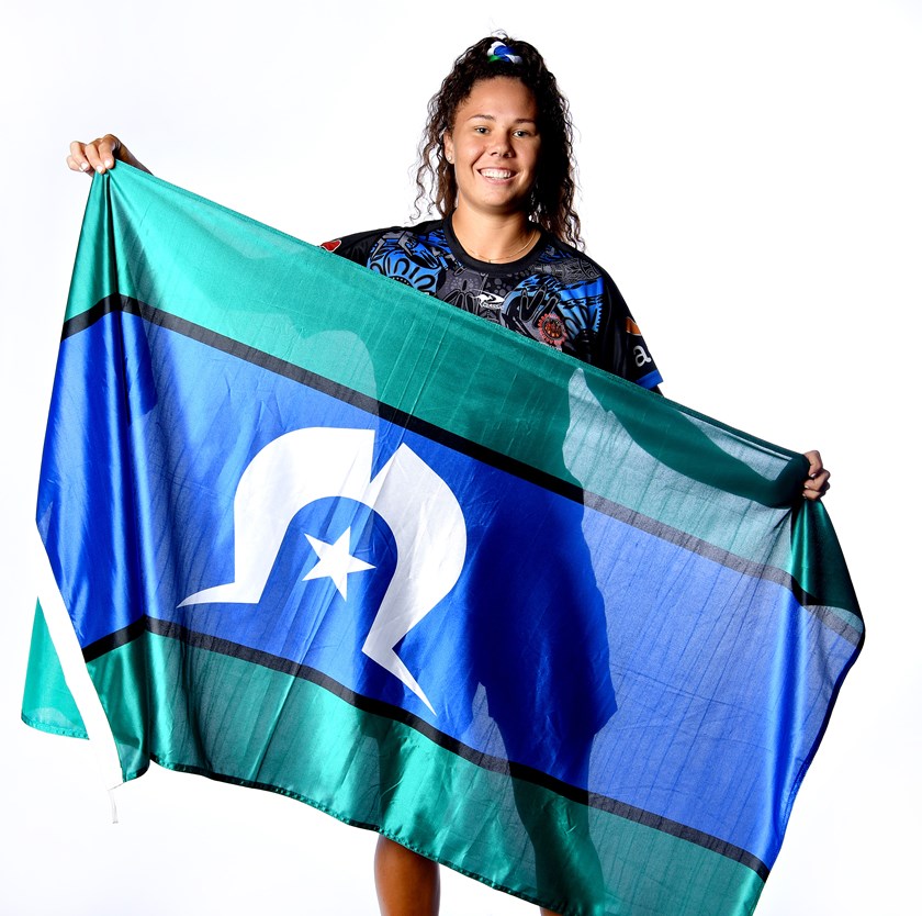 Tahlulah Tillett poses with the Torres Strait flag ahead of the game.