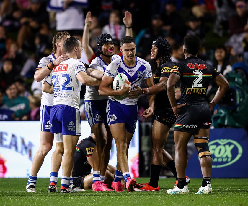 Stephen Crichton and Bulldogs players celebrate a Jacob Kiraz try against Penrith.