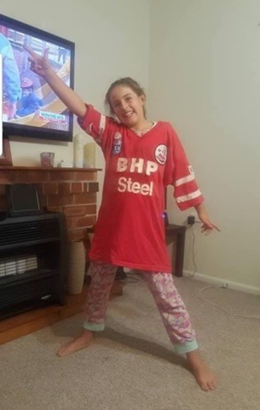 Bronte in one of her Dad's old Steeler's jumpers when she was young.