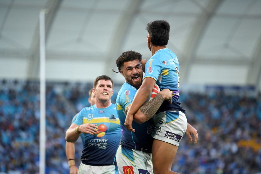 Jojo Fifita and Keano Kini celebrating after combining for one of their multiple tries against the Broncos.