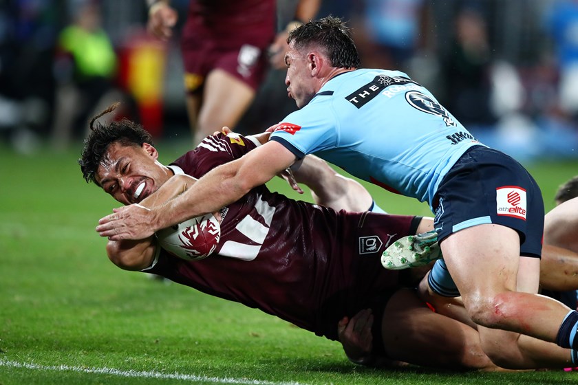 NSW hooker Reece Robson makes a try-saving tackle on Jeremiah Nanai in Game One as the Blues fought desperately to remain in the contest. 