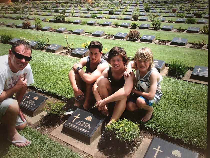 Tom Starling (second from right) visiting his great-grandfather's grave in Thailand.
