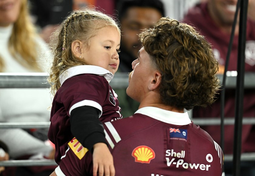 Reece Walsh with his daughter Leila during Game One.