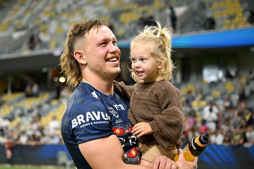 Reuben Cotter with daughter Sunny at a North Queensland Cowboys match.