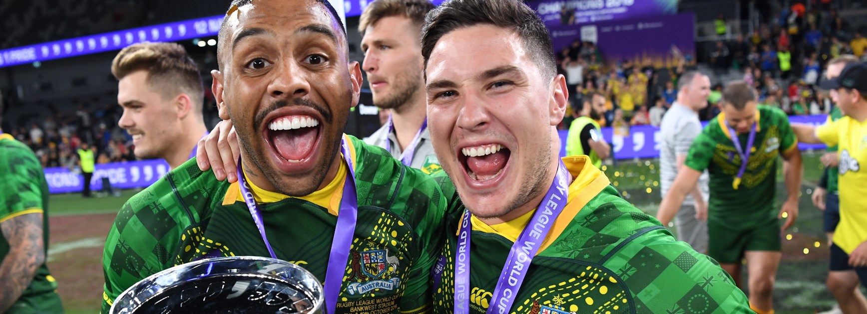 Josh Addo-Carr and Mitch Moses celebrate Australia's win.