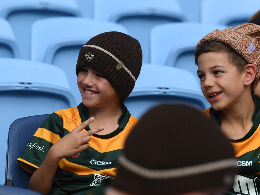 Young fans show off the 2024 beanies at the Beanie For Brain Cancer round launch.