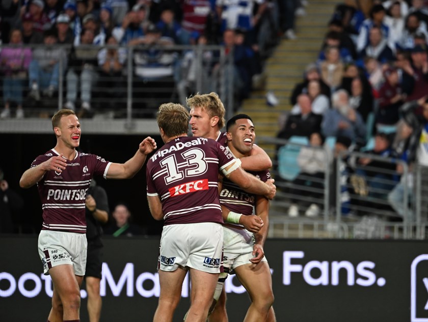 Sea Eagles players celebrate after Tolu Koula's match winning try against the Bulldogs.