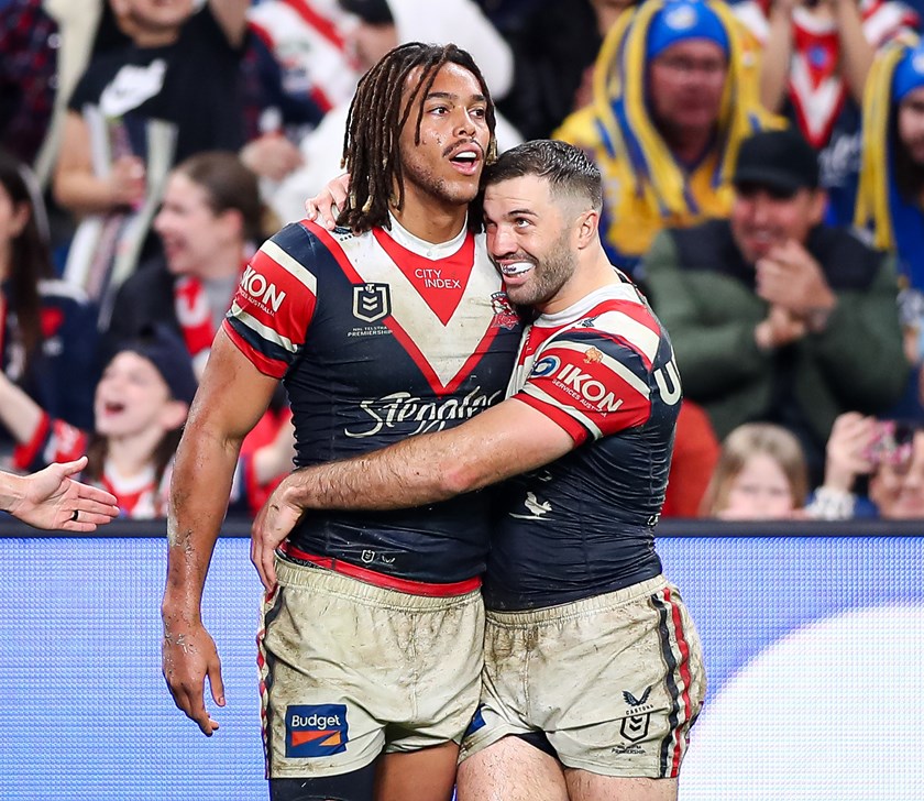 Dom Young and James Tedesco celebrate one of the English winger's 19 tries in his first season with Sydney Roosters.