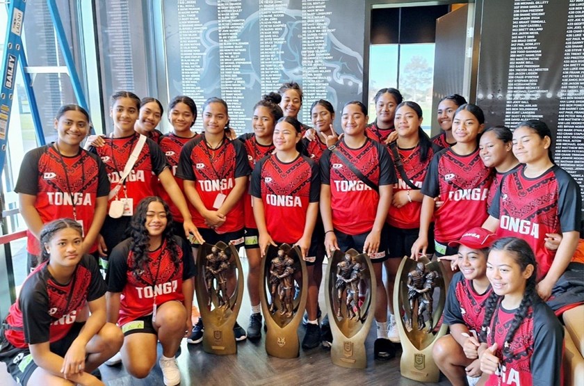 The Tongan Schoolgirls team with the Panthers' NRL premiership trophies from 2003, 2021, 2022 and 2023.