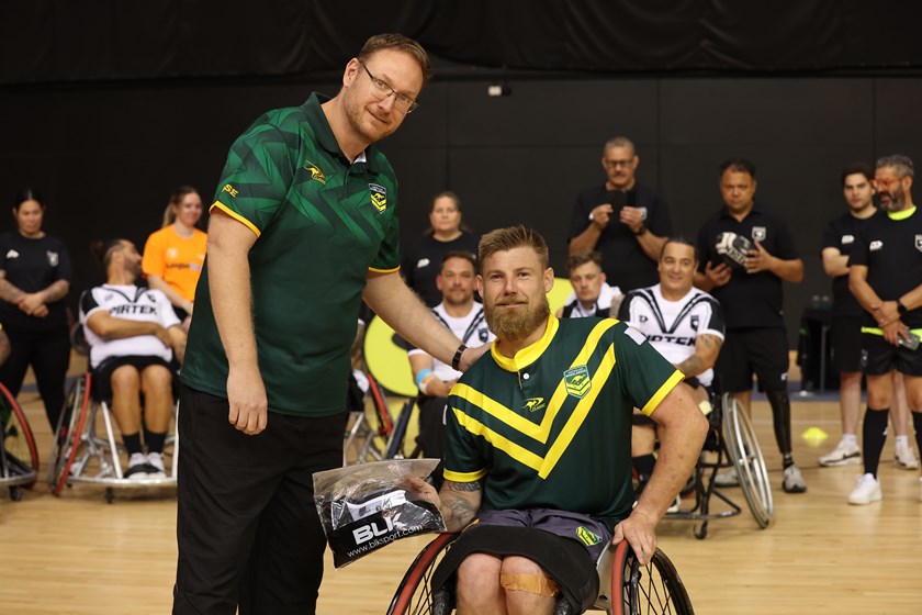 Wheelaroos coach Brett Clarke presents Zac Schumacher with his player of the match award after the second Test in New Zealand.