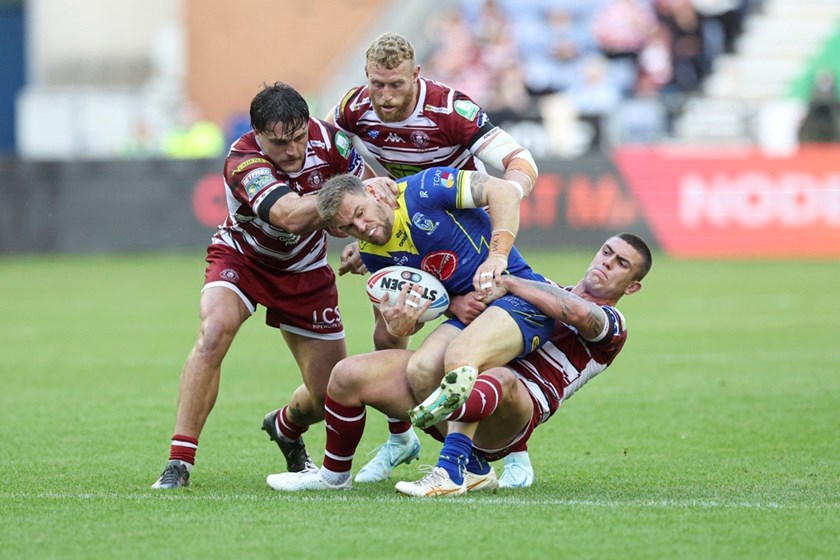Warrington fullback Matt Dufty is tackled in the top-of-the-table clash with Wigan