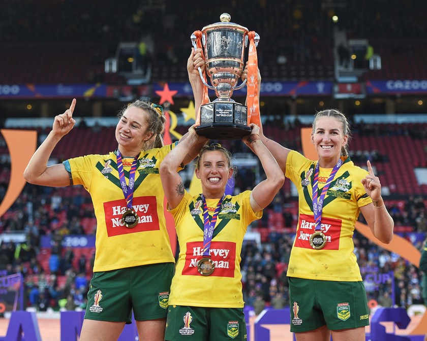 Jillaroos co-captains Kezie Apps, Sam Bremner and Ali Brigginshaw celebrate after winning the World Cup at Old Trafford in 2022.